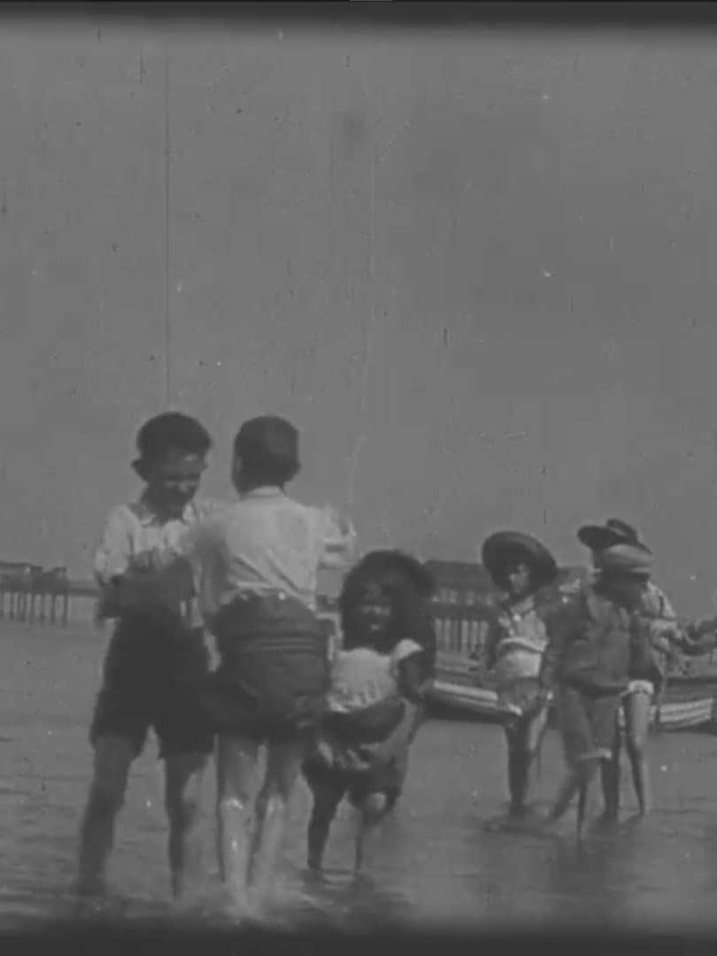 Children Playing on the Beach at Rhyl backdrop