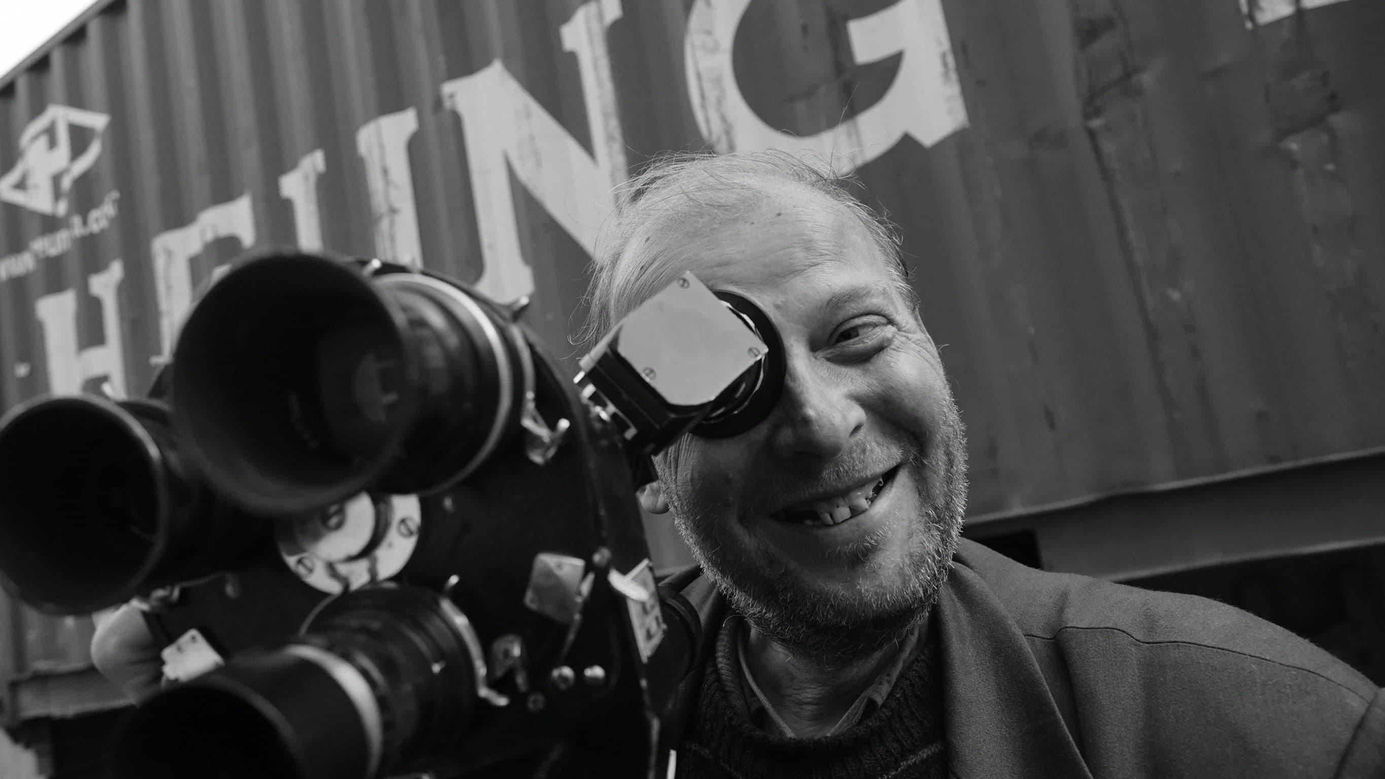 A Homeless Man With A Movie Camera backdrop